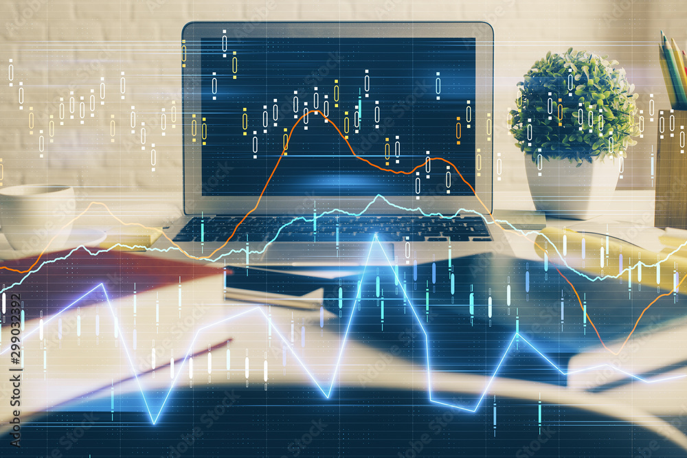 Forex market graph hologram and personal computer on background. Multi exposure. Concept of investment. Forex market graph hologram and personal computer on background. Multi exposure. Concept of investment.