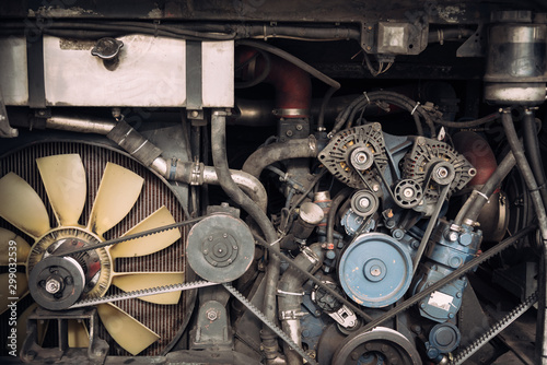 Close up powerful Diesel engine bus with Motor, pulleys, belt, gear and parts elements.