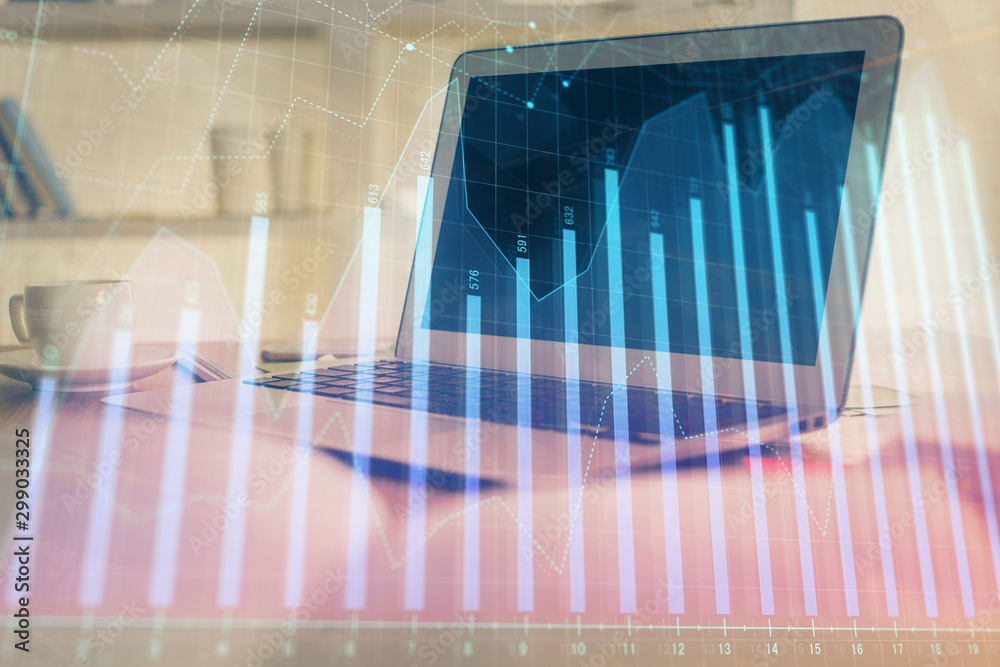 Stock market graph on background with desk and personal computer. Double exposure. Concept of financial analysis. Stock market graph on background with desk and personal computer. Double exposure. Concept of financial analysis.