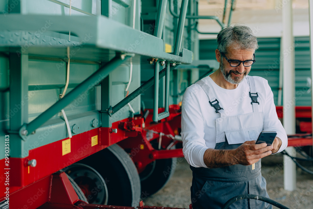 mid aged agronomy worker using tablet outdoors