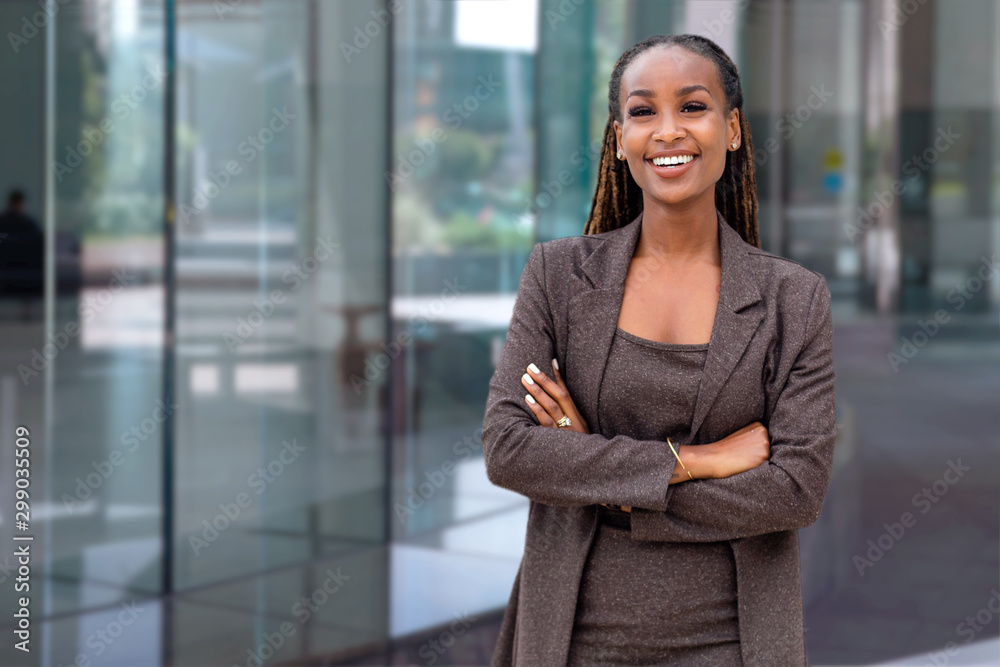 Beautiful cheerful african american executive business woman at the  workspace office Stock Photo
