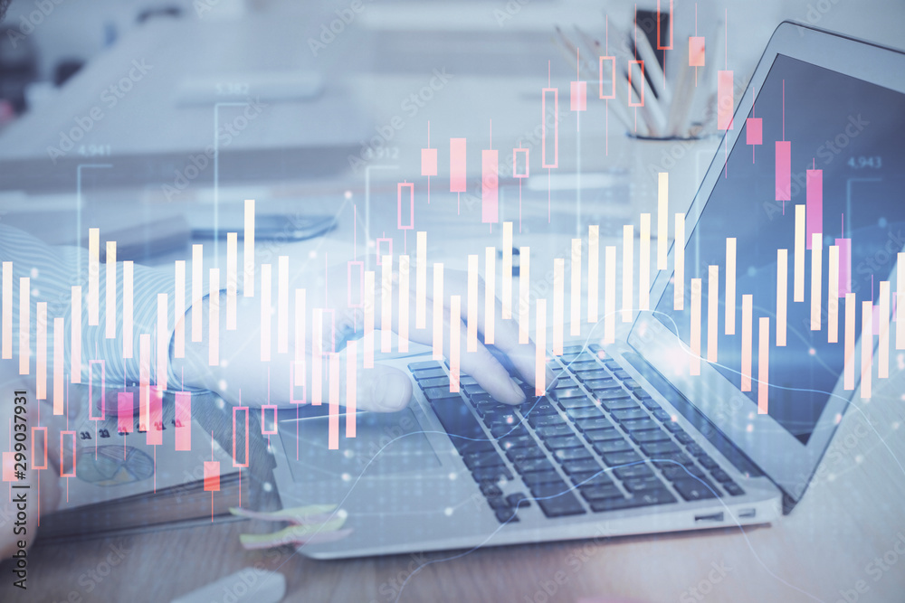 Multi exposure of stock market graph with man working on laptop on background. Concept of financial analysis. Multi exposure of stock market graph with man working on laptop on background. Concept of financial analysis.