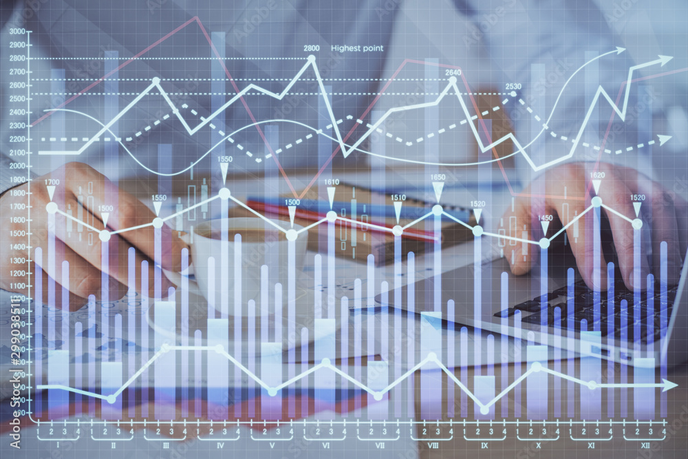 Forex graph with businessman working on computer in office on background. Concept of hardworking. Double exposure. Forex graph with businessman working on computer in office on background. Concept of hardworking. Double exposure.