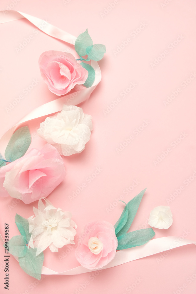 Greeting card with paper flowers on rose background.