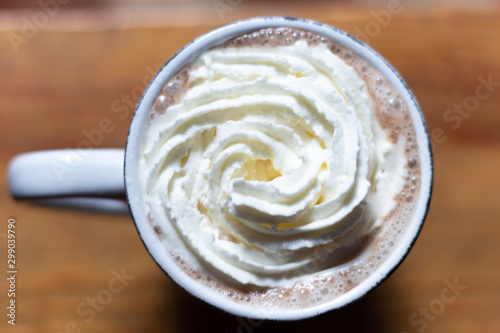 cup of hot drink with cream atmosphere winter cold cocoa cappuccino on the hookah table