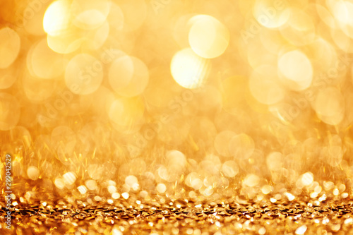 Golden holiday background bokeh. Abstract background. Selective focus. photo