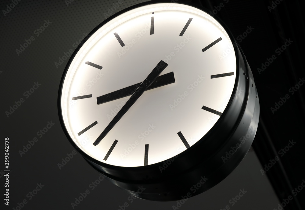 Minimalistic image of the clock on the black background