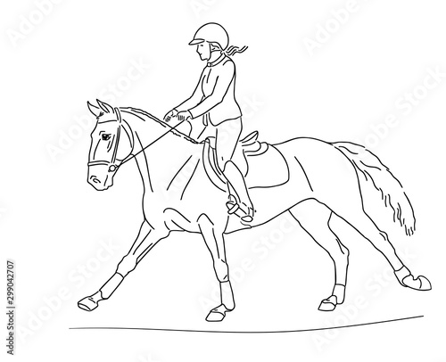 Young rider on a sports pony in the arena