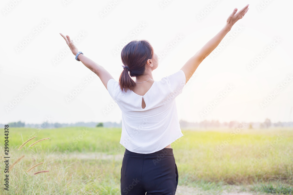Young woman raise hands up for her success, Concept of Success in life. Young woman raise hands up for her success, Concept of Success in life.