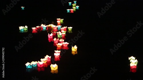 Glowing lanterns floating on the river  in the Hoi An  city, Vietnam