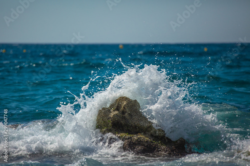 Fototapeta Naklejka Na Ścianę i Meble -  sea wave splashes over stone