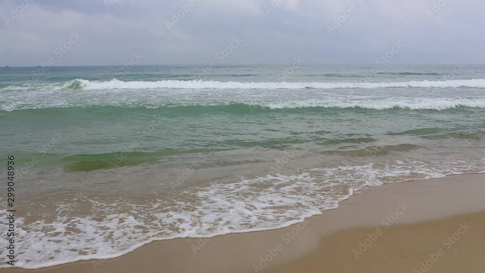 Pacific Ocean waves on the beach in the town of Hoi An, Vietnam Pacific Ocean waves on the beach in the town of Hoi An, Vietnam