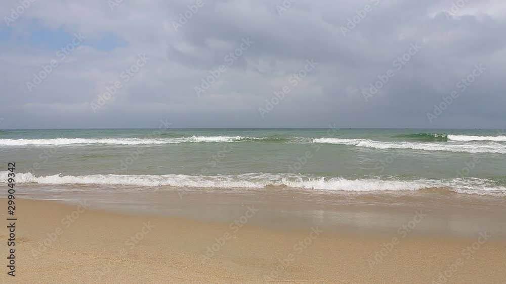 Pacific Ocean waves on the beach in the town of Hoi An, Vietnam Pacific Ocean waves on the beach in the town of Hoi An, Vietnam
