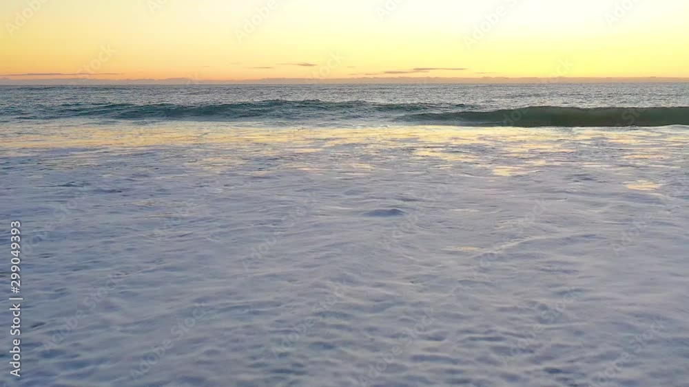 Flying towards a row of crashing waves Flying towards a row of crashing waves
