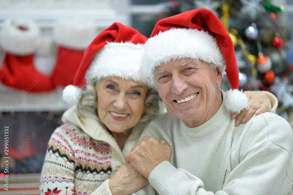 Close up portrait of senior couple in Santa hats Close up portrait of senior couple in Santa hats