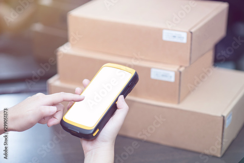 hand holding portable barcode scanner