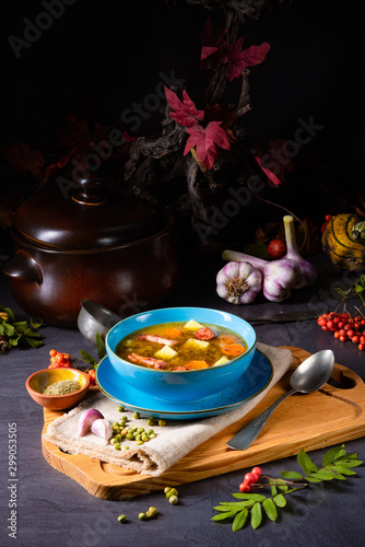 polish pea soup (grochowka) with smoked bacon and sausage photo