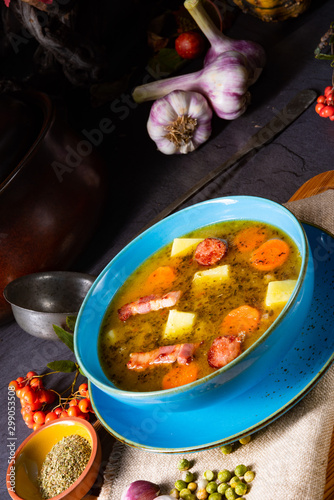 polish pea soup (grochowka) with smoked bacon and sausage photo