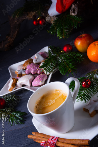 Hot chocolate with colorful christmas biscuits