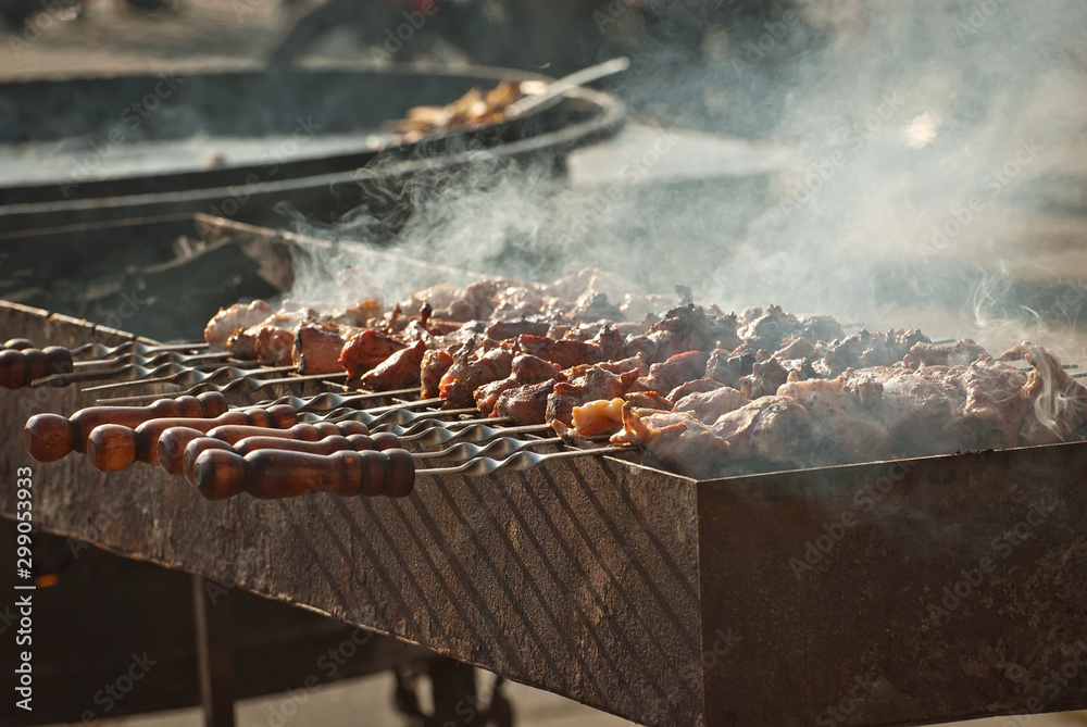 Slice pieces of meat on the grill. barbecue at the festival. Cheese and roasted veal on skewers. Slice pieces of meat on the grill. barbecue at the festival. Cheese and roasted veal on skewers.