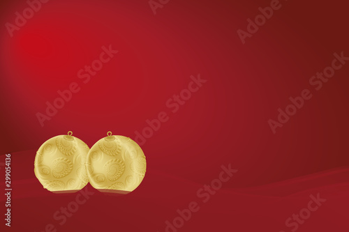 Zwei liegende Christbaumkugeln in gold mit Rosenornamenten auf einer Welle bei dunklrotem Hintergrund. photo