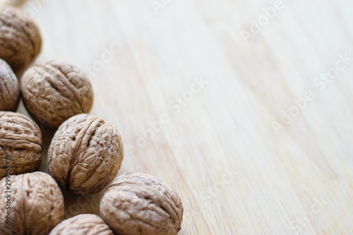 Walnut background. For articles about the garden, autumn harvest. Copy space. Free space for note and text.