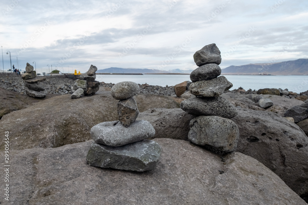 Close to the Harpa concert hall in Reykjavik are hundreds of cairns, who were originally to be found as trail markers in unclear terrain and are now built predominantly by travelers. Close to the Harpa concert hall in Reykjavik are hundreds of cairns, who were originally to be found as trail markers in unclear terrain and are now built predominantly by travelers.