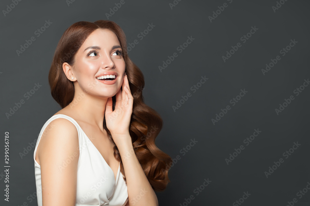 Happy surprised woman portrait. Gorgeous excited model with perfect hairstyle smiling Happy surprised woman portrait. Gorgeous excited model with perfect hairstyle smiling