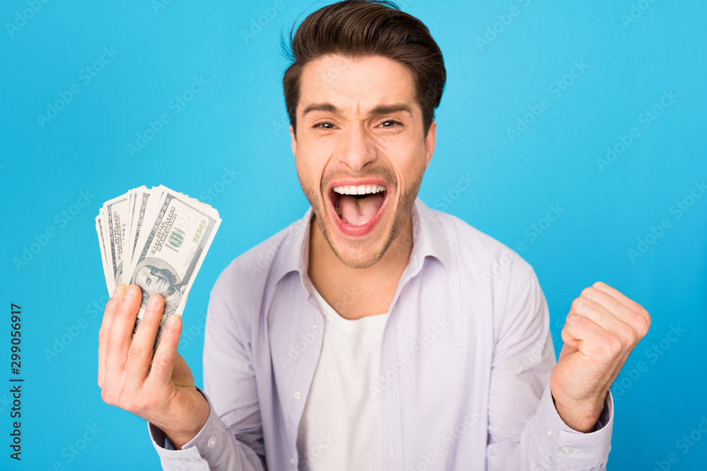 Big luck. Overjoyed man holding money and shouting Big luck. Overjoyed man holding money and shouting