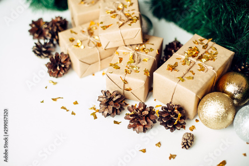 Christmas decorations, gift boxes, pine cones on white background. Holiday composition.