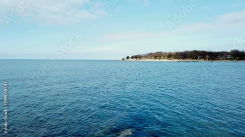 A vast blue ocean , a clear blue sky all together in a serene mesmerizing view. Tilt up. Polidor Croatia. 4k.