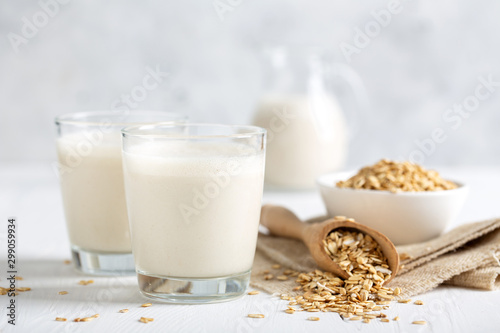 Oat milk. Healthy vegan non-dairy organic drink with flakes