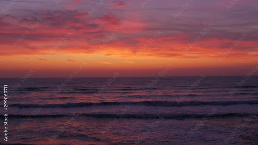 Red sky with clouds before sunrise above the sea. Red sky with clouds before sunrise above the sea.