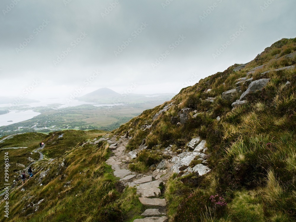 Path in a mountains. Diamond hill, Connemara National park, Low clouds,