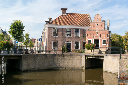 Canal with old house in Franeker, Netherlands