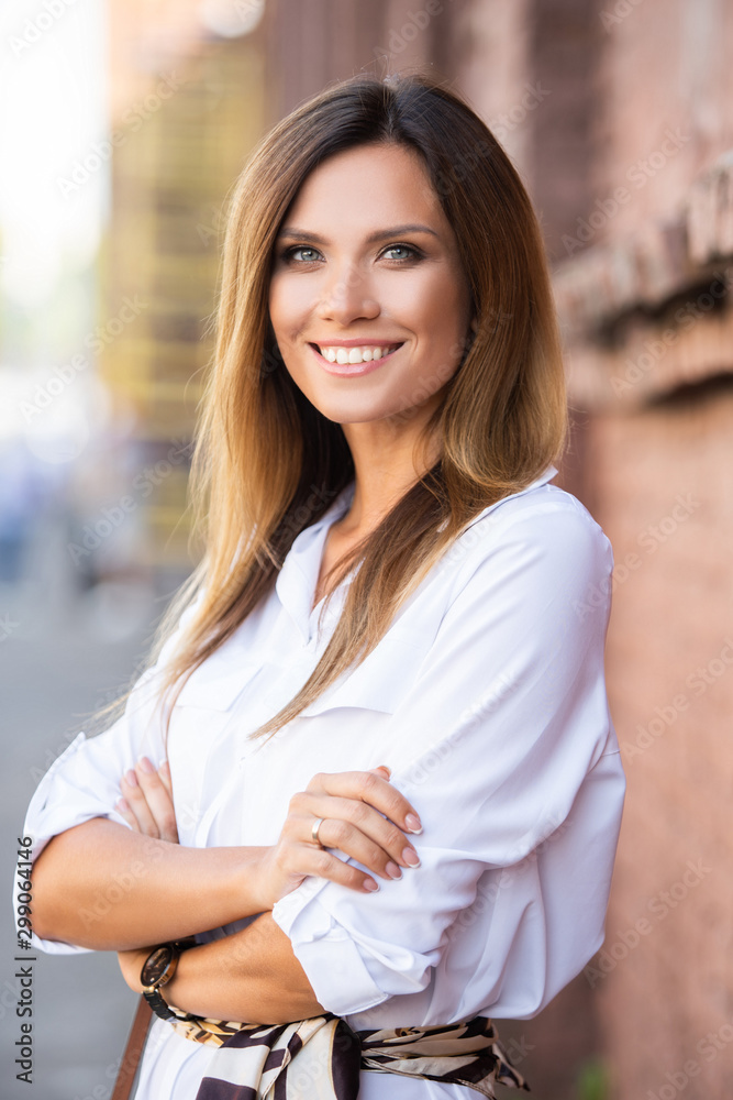 Portrait of a successful business woman smiling Portrait of a successful business woman smiling