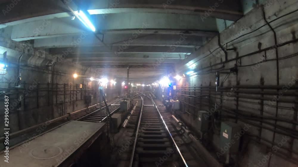 Time lapse of subway train starts from a dead end and moving at dark tunnel. Fast speed underground train riding in a tunnel of the modern city. Point of view from the railway cabin. Timelapse POV Time lapse of subway train starts from a dead end and moving at dark tunnel. Fast speed underground train riding in a tunnel of the modern city. Point of view from the railway cabin. Timelapse POV