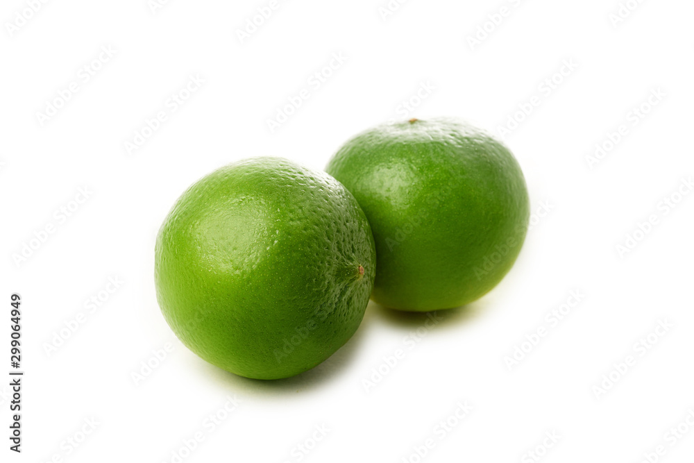 Two fresh whole limes isolated on white background Two fresh whole limes isolated on white background