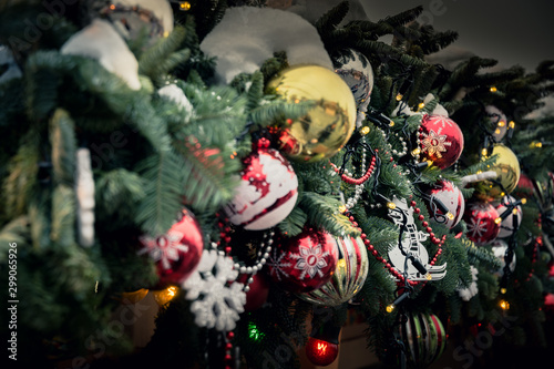 Details decorated Christmas kiosk with red, golden balls, garland. Outdoor fair. Xmas pattern. Close up. Winter. © svetlana_cherruty