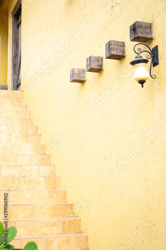Exterior yellow stairs with thw wall © Patcharida