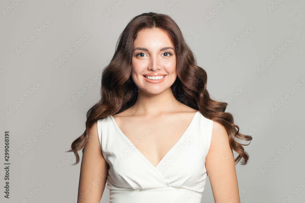 Beautiful stylish woman with long curly hair smiling Beautiful stylish woman with long curly hair smiling