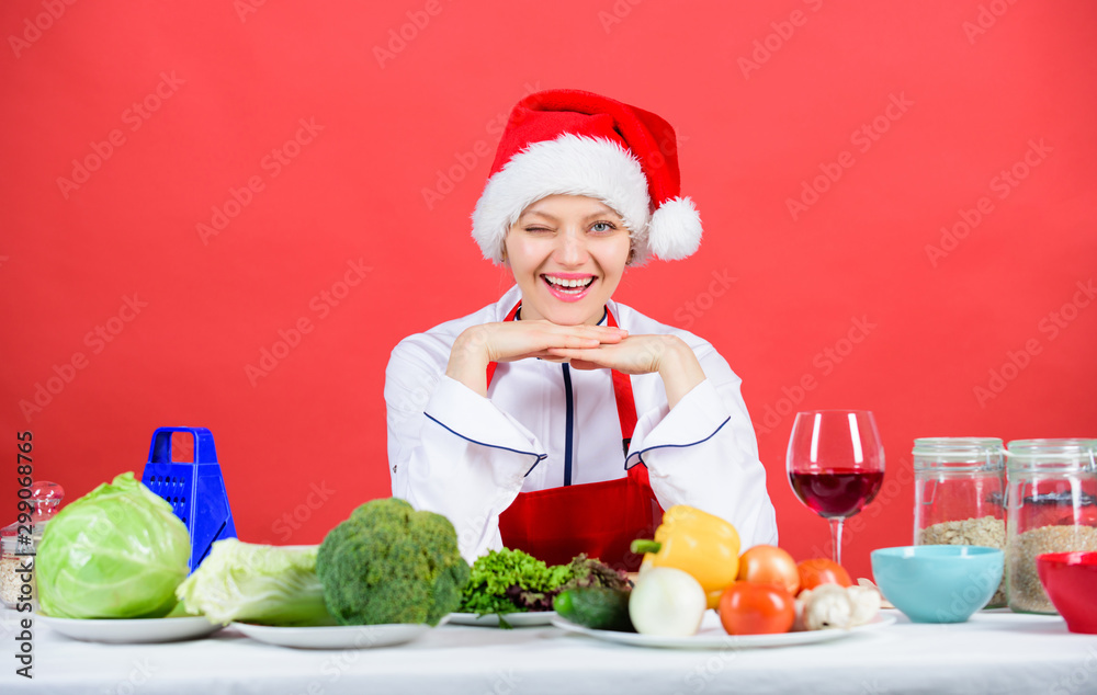 Christmas dinner idea. Cooking for family. Healthy christmas holiday recipes. Easy ideas for christmas party. Best christmas recipes of perfect housewife. Woman chef santa hat cooking at kitchen Christmas dinner idea. Cooking for family. Healthy christmas holiday recipes. Easy ideas for christmas party. Best christmas recipes of perfect housewife. Woman chef santa hat cooking at kitchen