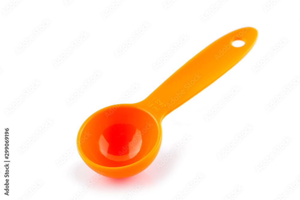 measuring spoon of plastic on white background.