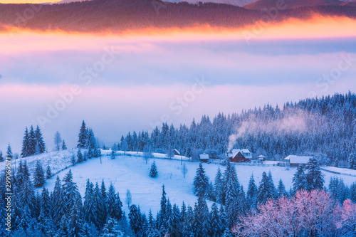 Fantastic winter landscape with wooden houses