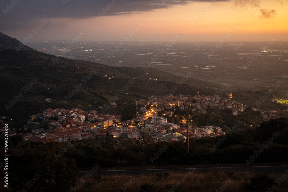 view of italian town from the hill at sunset