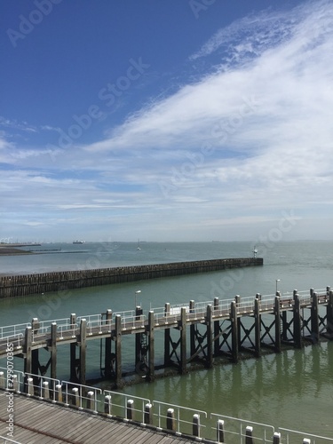 Vlissingen (Holland). August 2017. A multi-kilometer embankment with a port, moorings for boats and boats, as well as with many cafes where you can try fried fish.