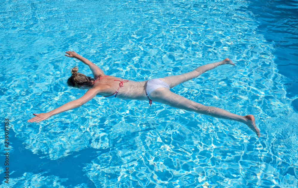 Woman playing dead in the pool
