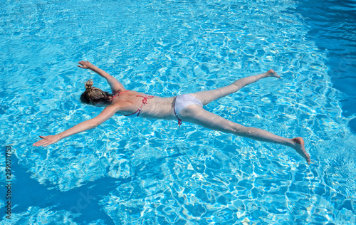 Woman playing dead in the pool