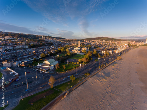 Editorial SWANSEA, UK - OCTOBER 22, 2019: Traffic on the busy Oystermouth road and the landmarks of The Patti Pavilion, The Guildhall and Victoria Park,