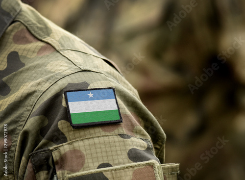 Flag of Puntland State of Somalia on military uniform. Army, troops, soldiers. Collage.